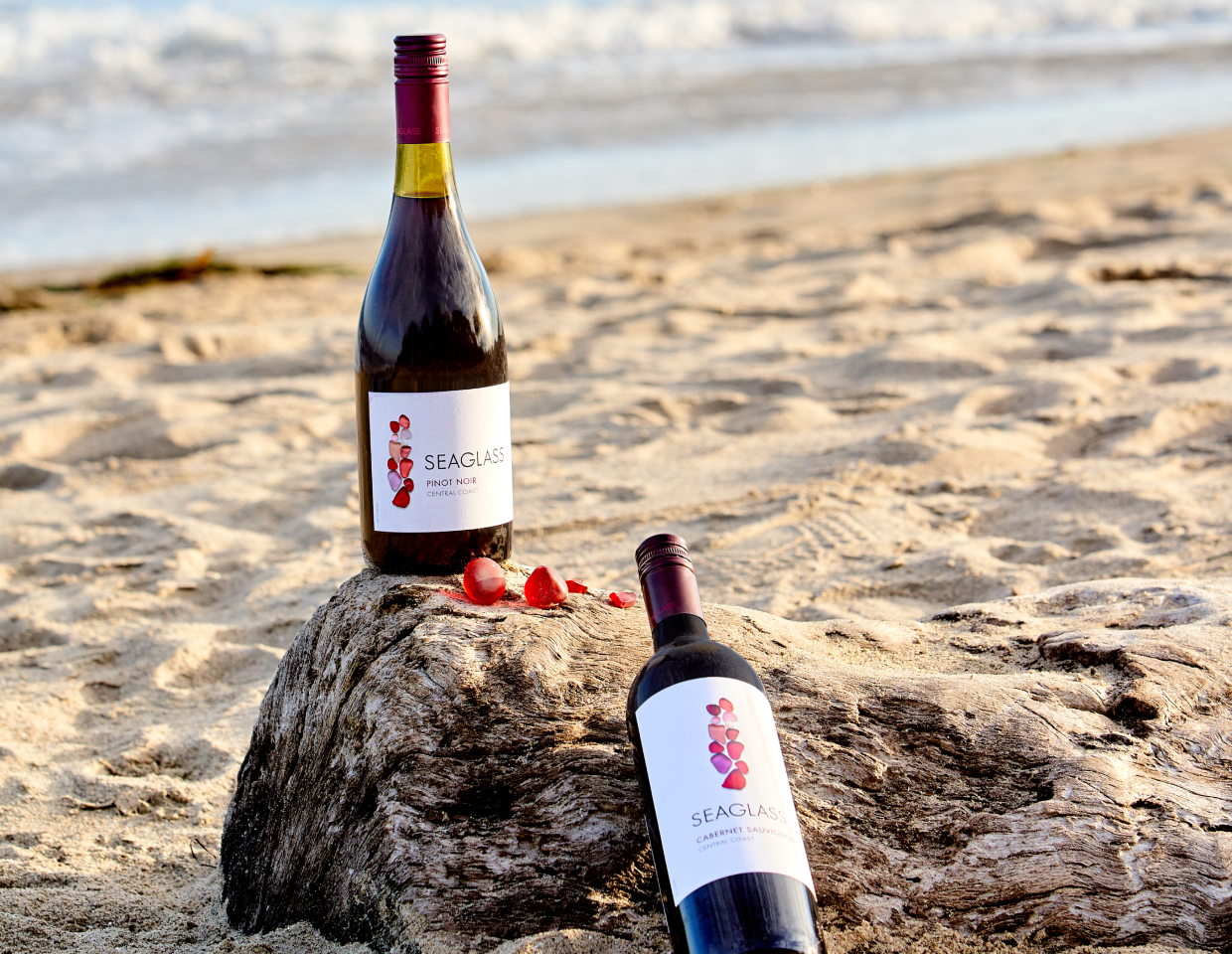 Bottle of Seaglass Pinot Noir and Cabernet Sauvignon on the beach