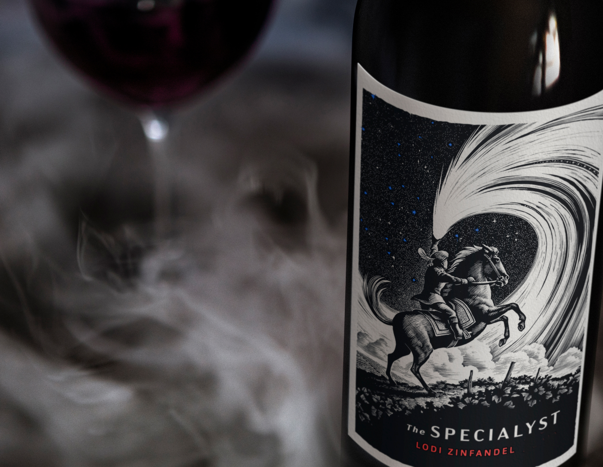 Close up of a bottle of The Specialyst Lodi zinfandel with smoke surrounding it.