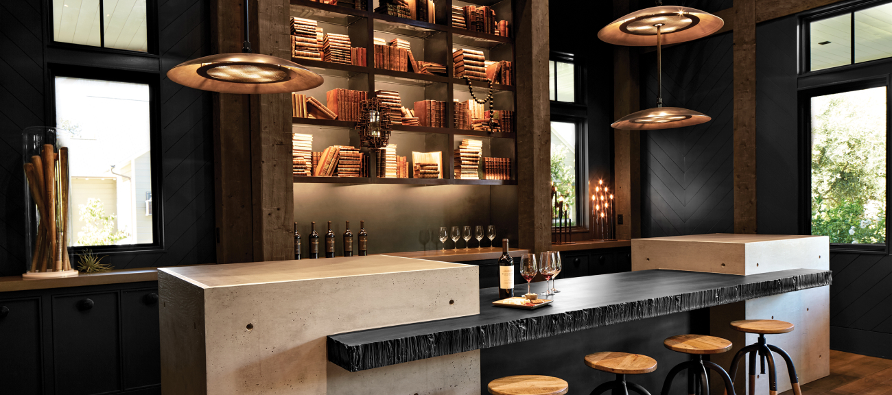 Trinchero Napa Valley tasting room main bar, low-lit with rich wood tones.