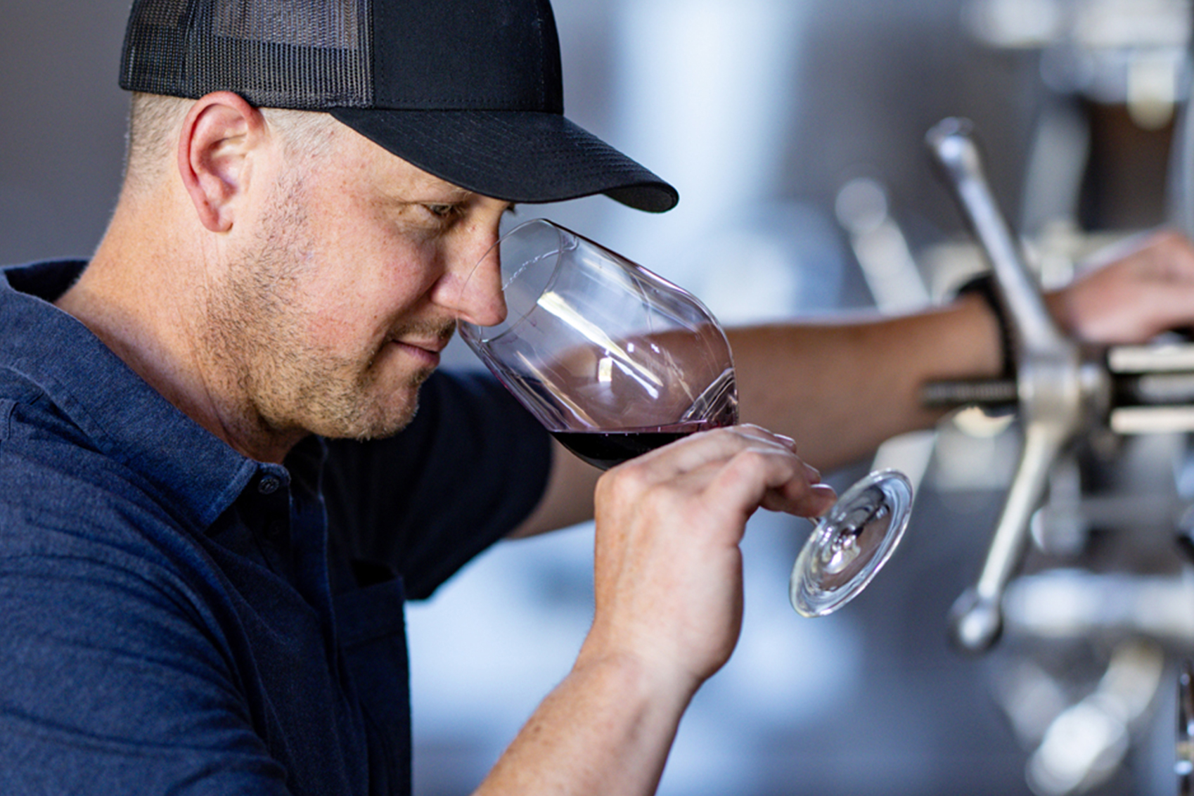 Quattro theory winemaker Landon Donley sampling wine