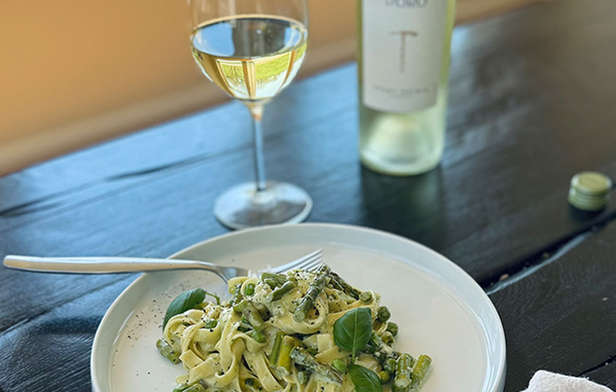 A delicious plate of spring pesto pasta, get the recipe from One Stop Wine Shop and pair with a glass of Terra d'Oro Pinot Grigio.
