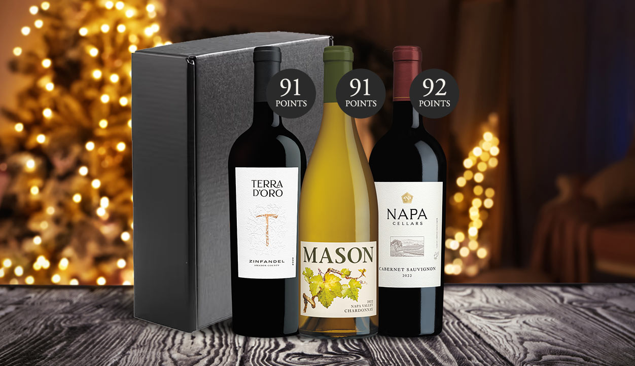 A top-scoring wine gift set from One Stop Wine Shop with a brightly light Christmas tree in the background. Shop this gift set and more.