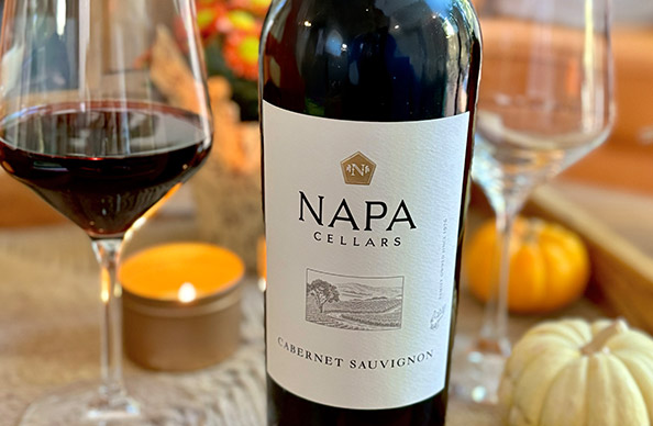 A bottle of Napa Cellars cabernet sauvignon with candles and mini pumpkins in the background